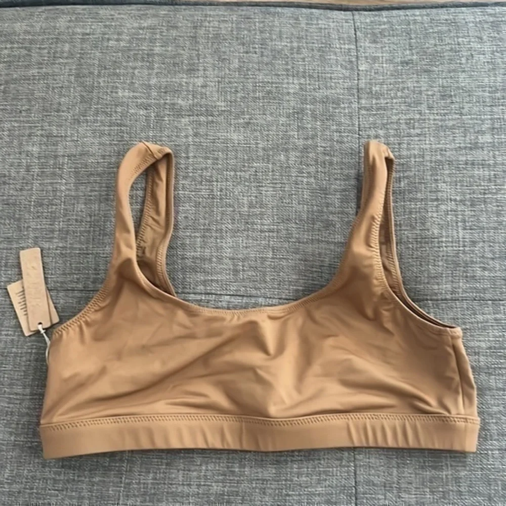 SKIMS swim tank